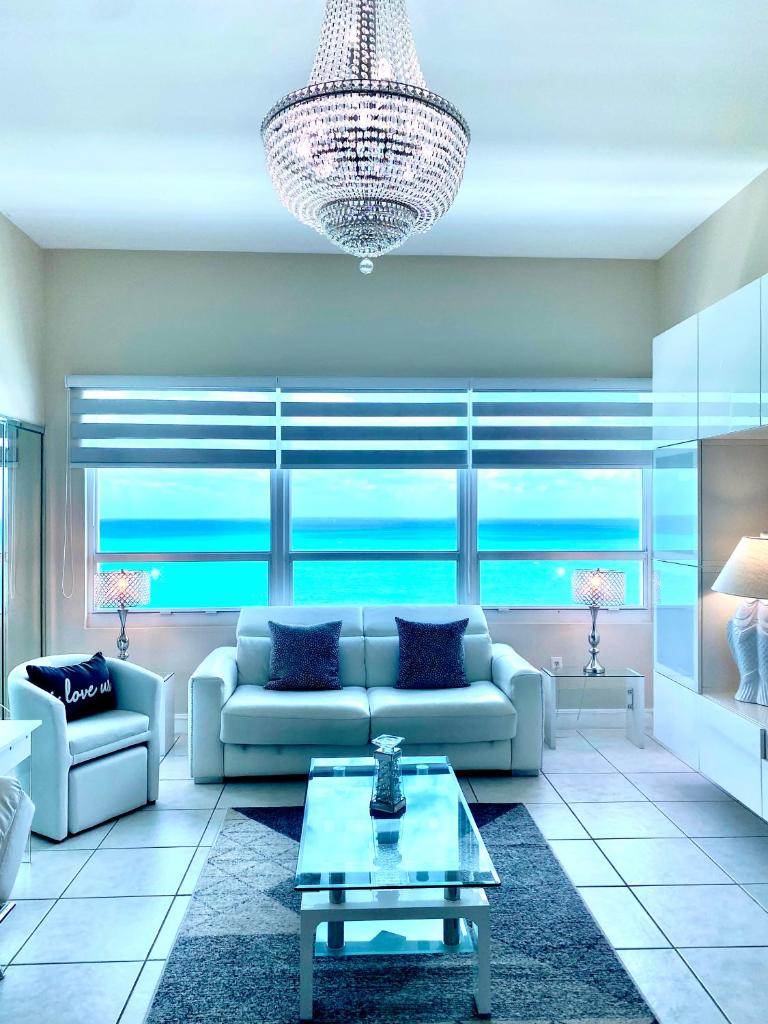 Large luxurious direct ocean front Penthouse or Deluxe one bedroom ocean front condo-free parking